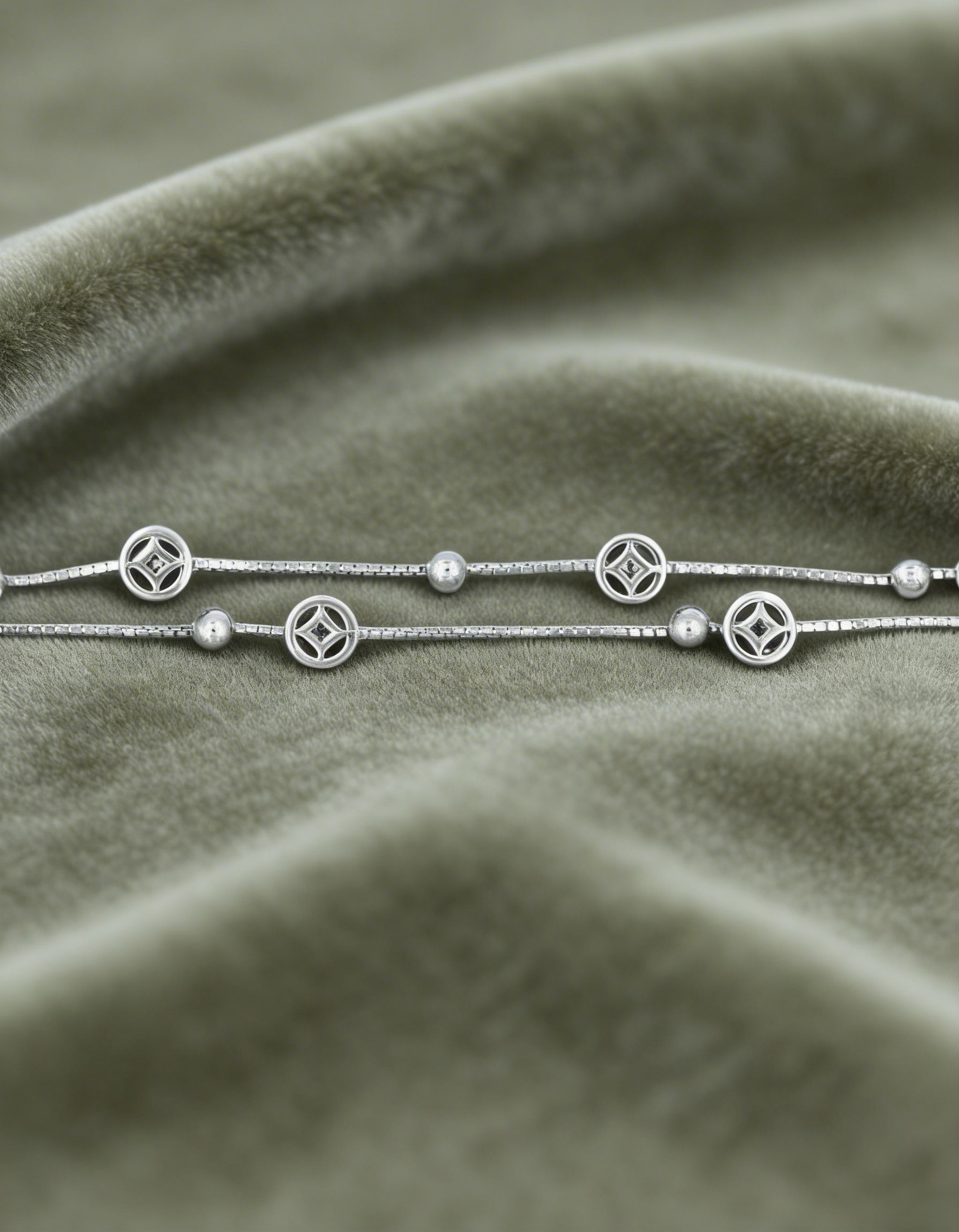 freepik__sterling-silver-bracelet-on-muted-velvet-soft-crus__86722